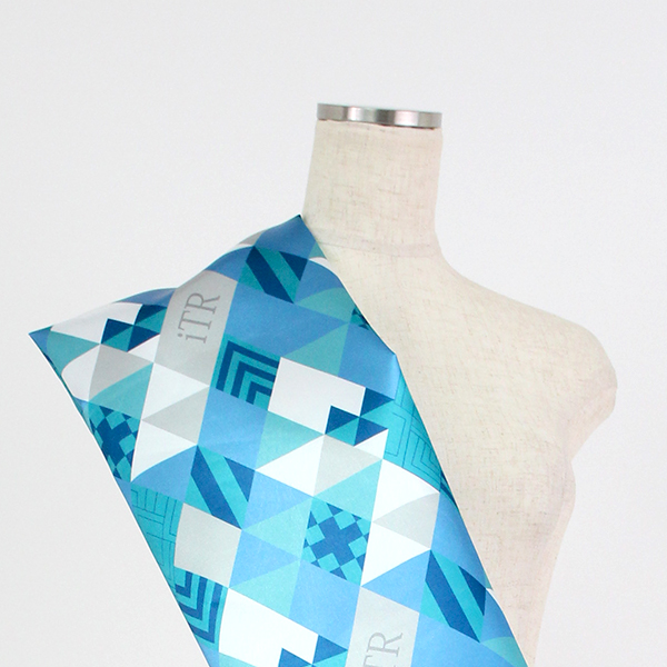 C0237　青緑ベース　幾何学ダイヤ柄生地