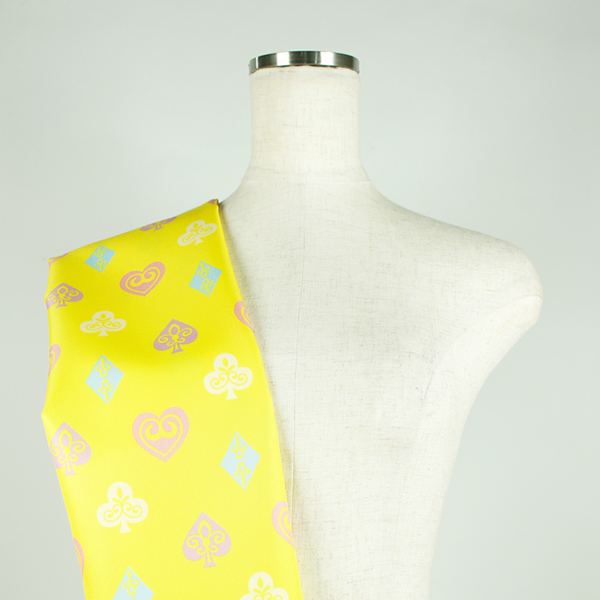 C0611　黄色ベースカラフルスート柄生地